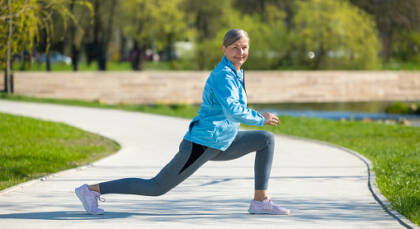 lunging. woman exercising in the park and doing lunging