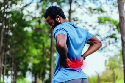 portrait of a mature man with back pain